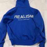 realism hoodie